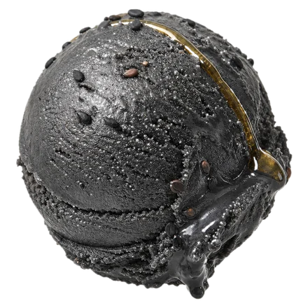 A scoop of glossy black sesame gelato scattered with seeds.