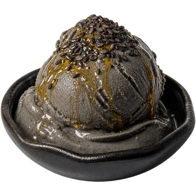 Black sesame seeds with honey in a small dish.