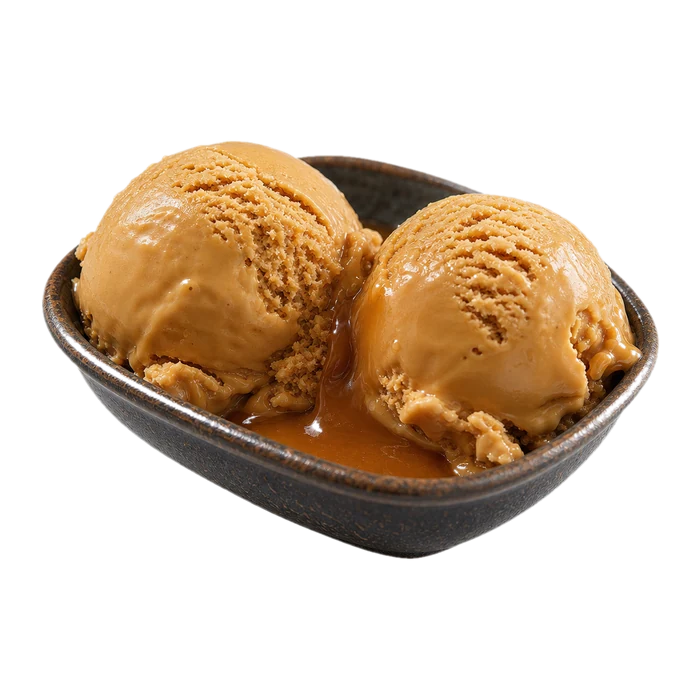 A scoop of caramel gelato with a deep burnished edge.